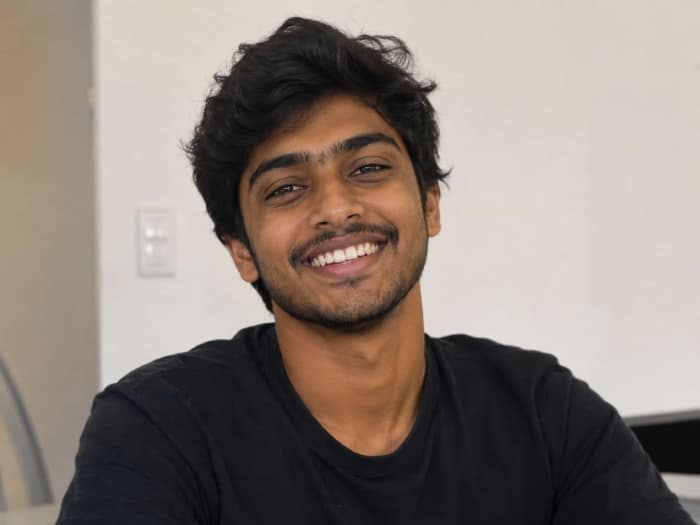 Young adult smiling after wisdom tooth extraction at Oral Edge, Thanisandra, Bengaluru